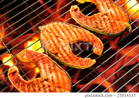 Grilled salmon on the flaming grill Grilled salmon on the flaming grill 25914537