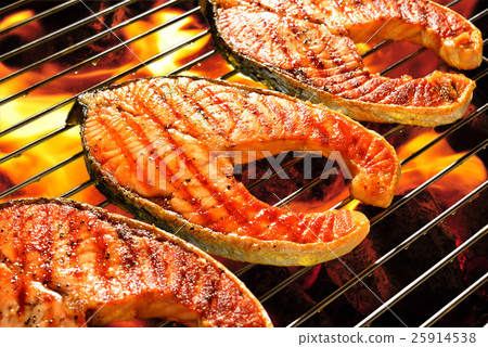 Grilled salmon on the flaming grill Grilled salmon on the flaming grill 25914538