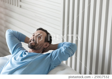 Joyful optimistic man having a wonderful mood Joyful optimistic man having a wonderful mood 25917532