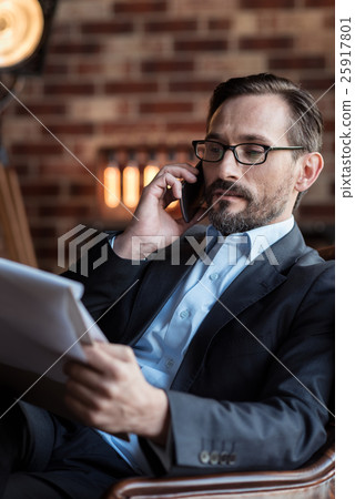 Good looking stylish businessman having a phone 25917801