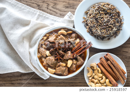 Thai Massaman Curry on the wooden background Thai Massaman Curry on the wooden background 25918597