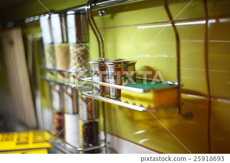 Salt Cellar and other spices on kitchen railings 25918693