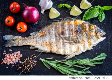 Grilled dorada fish fresh vegetables and herbs 25919120