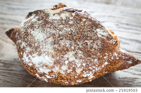 Wholegrain bread on the wooden background Wholegrain bread on the wooden background 25919503