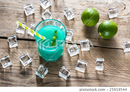 Glass of blue curacao and juice cocktail 25919544