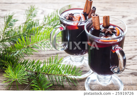 Two glasses of mulled wine with fir branch Two glasses of mulled wine with fir branch 25919726