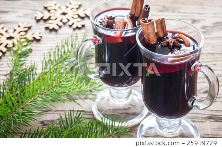 Two glasses of mulled wine with fir branch Two glasses of mulled wine with fir branch 25919729