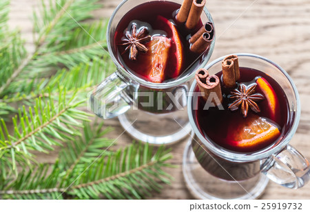 Two glasses of mulled wine with fir branch Two glasses of mulled wine with fir branch 25919732