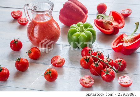 Fresh tomatoes, peppers and jug of juice Fresh tomatoes, peppers and jug of juice 25919863