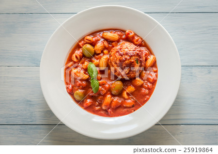 Portion of minestrone soup with meatball 25919864