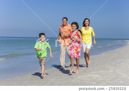 Mother Father and Children Family Running on Beach 25920328