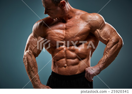 torso of attractive male body builder on gray torso of attractive male body builder on gray 25920341