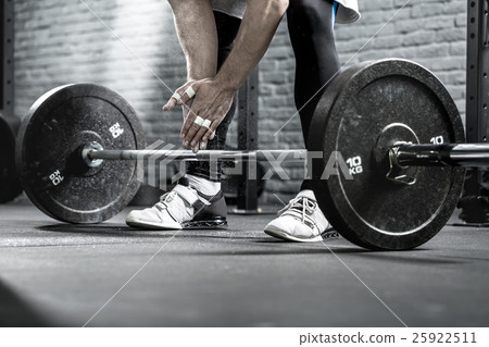 Barbell workout close-up 25922511