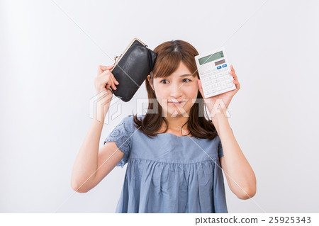 A woman with a wallet and a calculator A woman with a wallet and a calculator 25925343