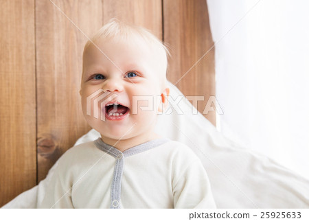 Cheerful toddler smiling Cheerful toddler smiling 25925633