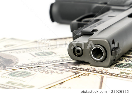 Close up image of pistol and dollar . Close up image of pistol and dollar . 25926525