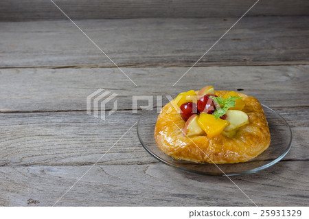danish pastry with fruits on wood background 25931329