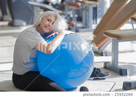 Happy smiling woman having fitness with fit ball. 25932260