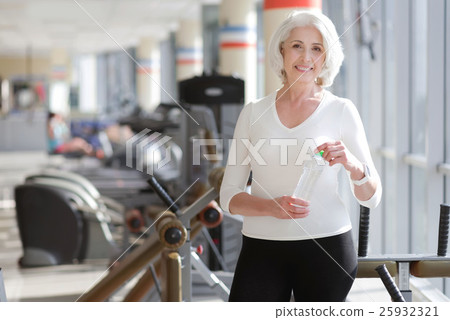 Athletic charming senior woman having rest during 25932321