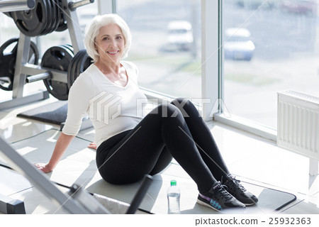 Cheerful senior woman relaxing in the gym. 25932363