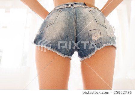 Sexy woman buttocks in denim shorts, free space 25932786