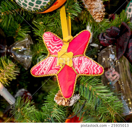 Christmas decorations on the branches of fir tree Christmas decorations on the branches of fir tree 25935013