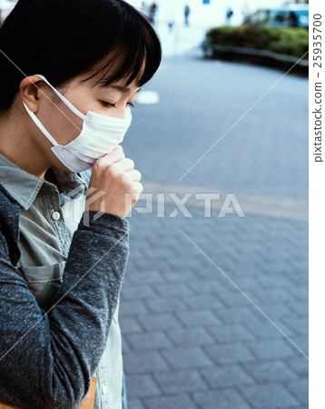 A woman with a mask to cough 25935700