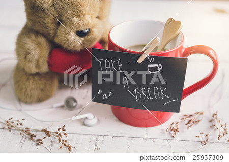 Teddy bear with red heart shape and cup of coffee Teddy bear with red heart shape and cup of coffee 25937309