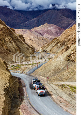 Indian lorry trucks on highway in Himalayas Indian lorry trucks on highway in Himalayas 25937404