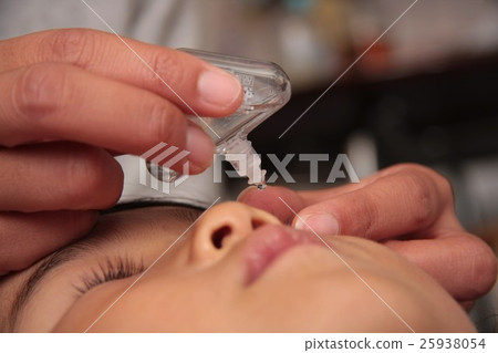 A girl with eye drops A girl with eye drops 25938054