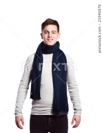 Teenage boy in sweater and scarf. Studio shot Teenage boy in sweater and scarf. Studio shot 25940876
