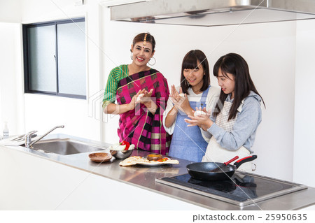 Young women learning Indian food Homestay Young women learning Indian food Homestay 25950635
