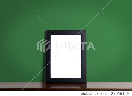 Black modern picture frame on green background Black modern picture frame on green background 25956329