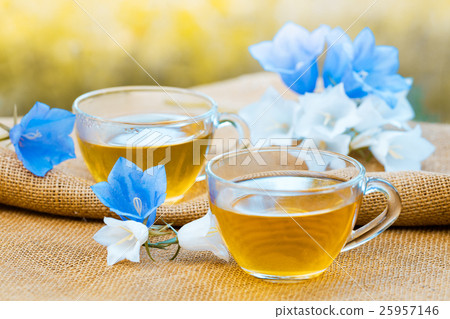 Two cups of herbal tee on grunge wooden table 25957146