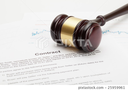 Judge's gavel over contract - close up studio shot 25959961