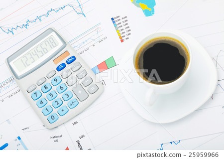 Coffee cup and calculator over world map Coffee cup and calculator over world map 25959966