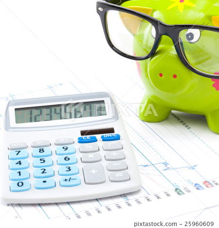 Market chart with a calculator and a piggy bank Market chart with a calculator and a piggy bank 25960609