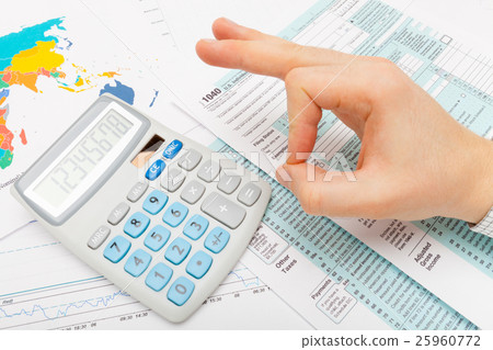 Male showing OK sign over 1040 US Tax Form Male showing OK sign over 1040 US Tax Form 25960772