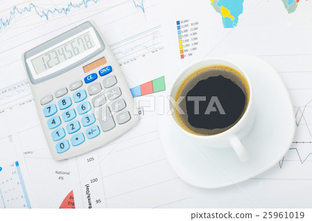 Calculator and cup of coffee Calculator and cup of coffee 25961019