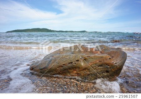Rock on sand and sea with blue sky Rock on sand and sea with blue sky 25961507