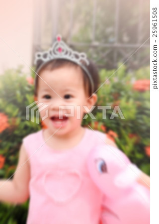 little girl with pink duck doll in hand and pink dress and diade little girl with pink duck doll in hand and pink dress and diade 25961508
