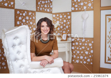 portrait of fashionable model young woman sitting 25961874