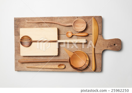 Various kitchen utensil on white wooden background 25962250