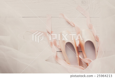 Pink ballet pointe shoes and tutu on white wood Pink ballet pointe shoes and tutu on white wood 25964213