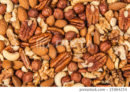Mix of different nuts closeup photo 25964254