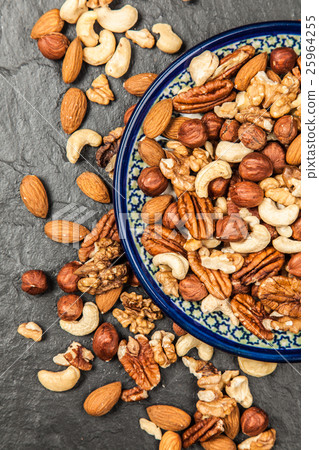 Mix of different nuts closeup photo 25964255