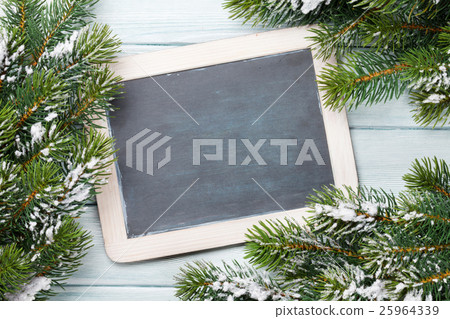 Christmas chalkboard and fir tree with snow 25964339