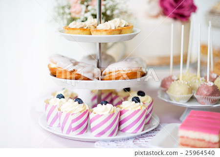 Tarts, crem puffs, cupcakes on cakestand. Cake Tarts, crem puffs, cupcakes on cakestand. Cake 25964540
