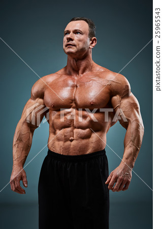 torso of attractive male body builder on gray torso of attractive male body builder on gray 25965543