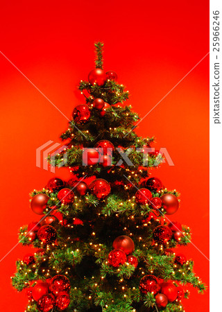 Green Christmas tree on red background. 25966246